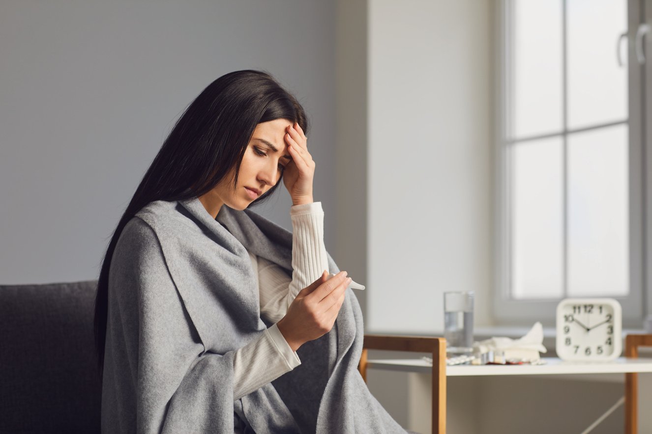 Sick Woman with Fever in the Room. Woman Feeling Unwell, Needing Medical Attention